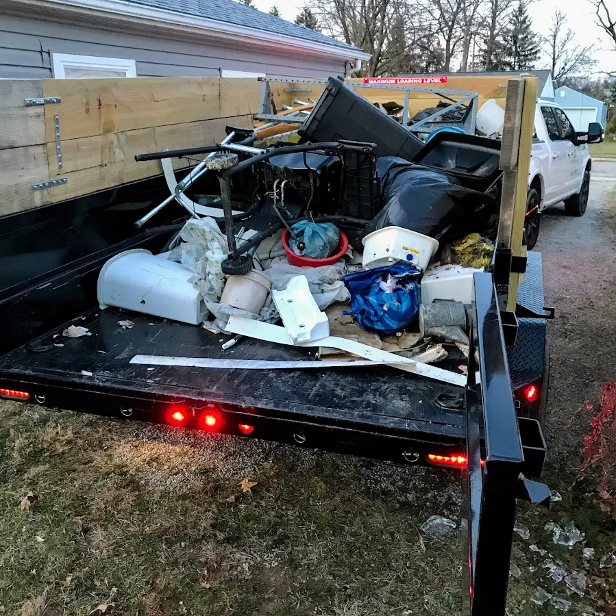 Roll-off dumpster delivered to a residential driveway in Oshtemo